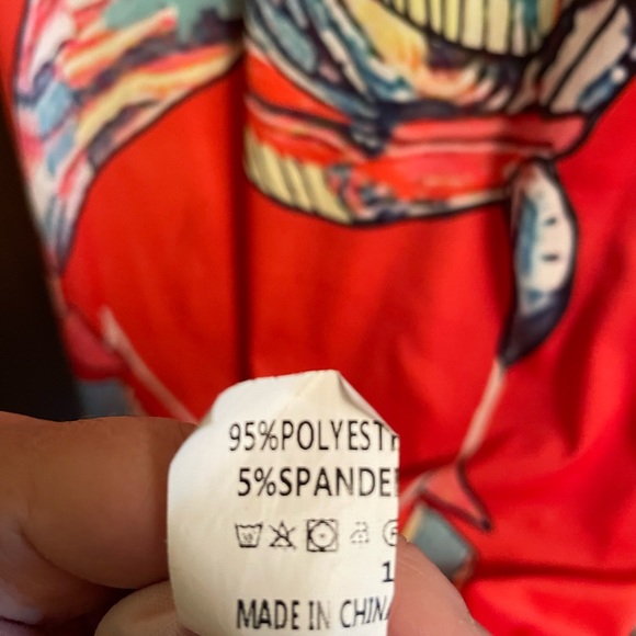 Orange body con dress with colorful motif of artist face and scarf on front. - Picture 4 of 4